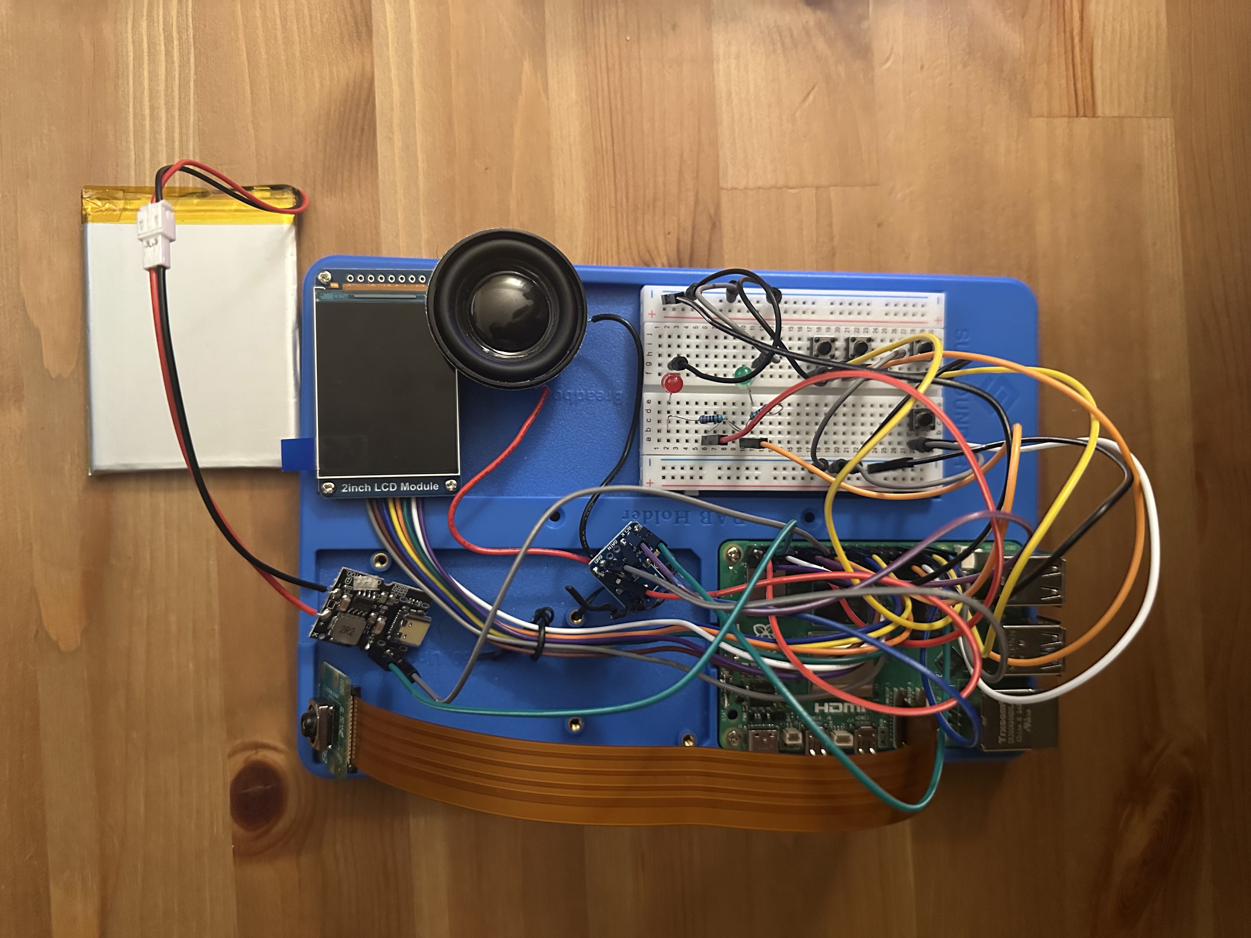 Breadboarded Raspberry Pi Pokédex with camera, amp, and buttons wired in